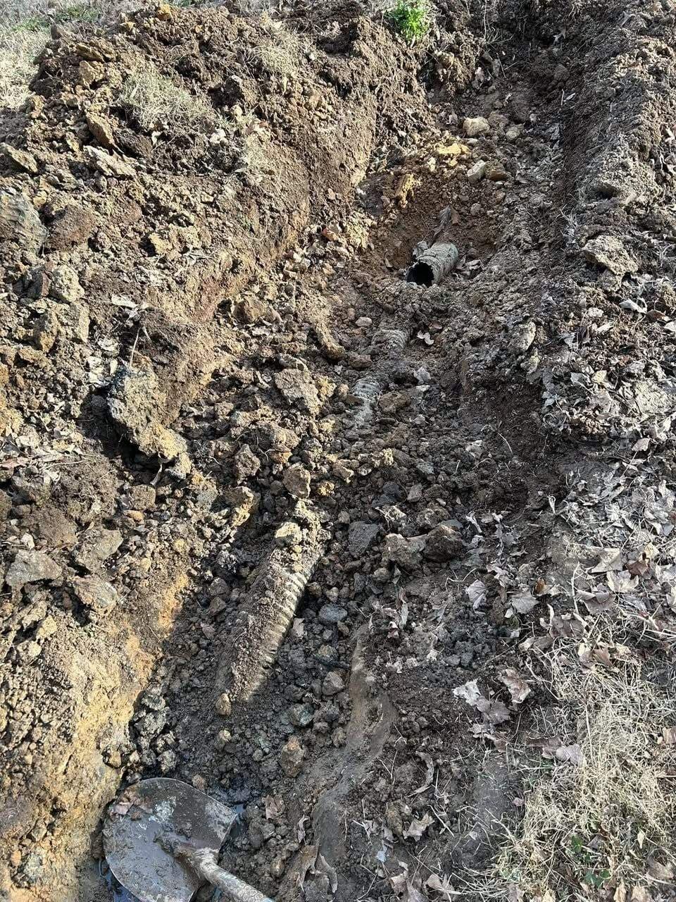 Crushed crossover pipe before repair